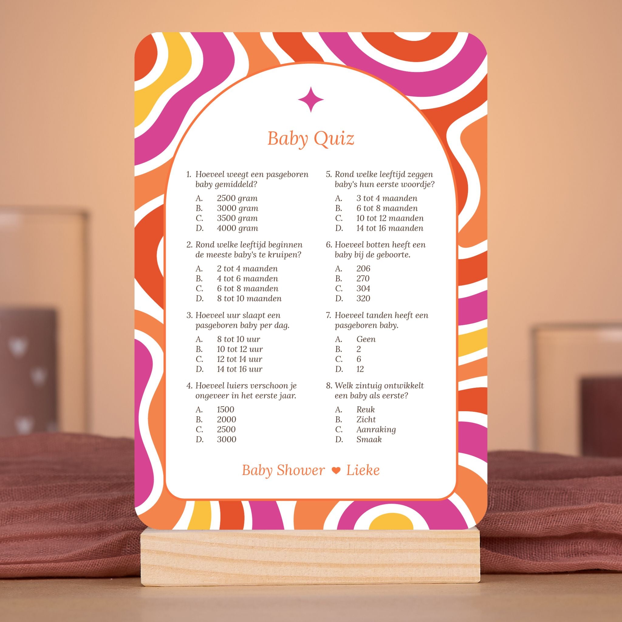 Baby Quiz kaart in Flower Power stijl in rood, paars, oranje en geel – sfeervolle setting met babyshower decoratie – Studio Miron